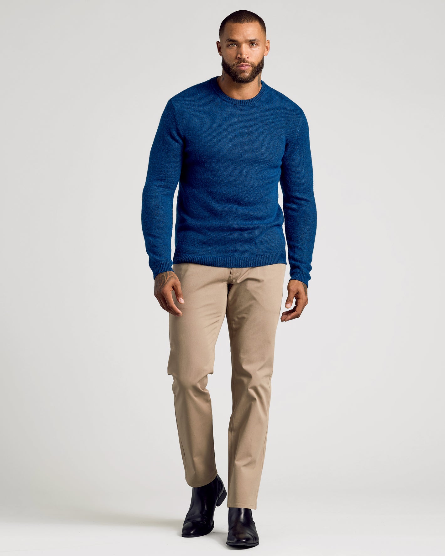 Heather Fiord Marled Crew Neck Sweater on model with chinos and boots.