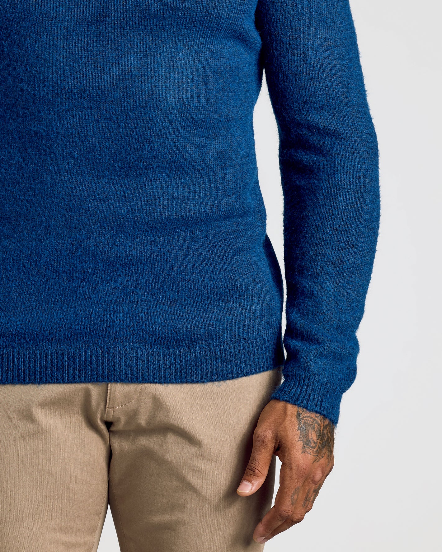 Heather Fiord Marled Crew Neck Sweater worn with tan pants.