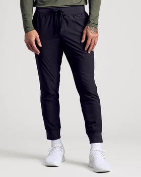 Black Active Training Joggers with elastic waist, ribbed cuffs, and sneakers.