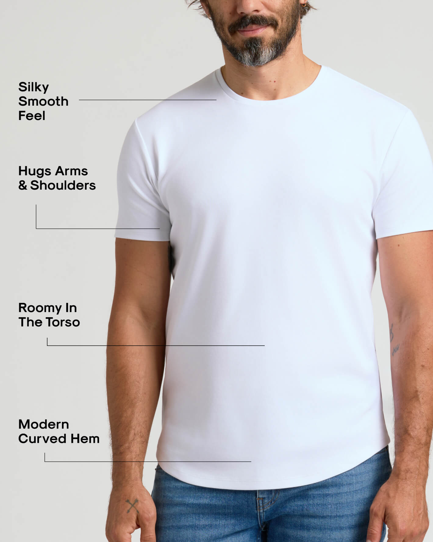 Man wearing a White Pima Cotton Blend Curved Hem Crew shirt featuring a silky smooth feel, snug fit on arms and shoulders, roomy torso, and modern curved hem design.