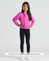 Girl in Girls Electric Fuchsia Slouch Pullover Crew, smiling confidently.