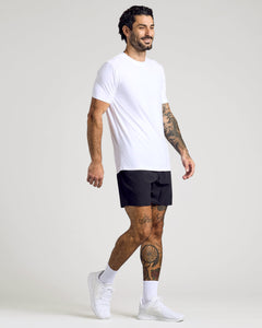True ClassicMan wearing White Active Crew Neck Tee, black shorts, white sneakers.