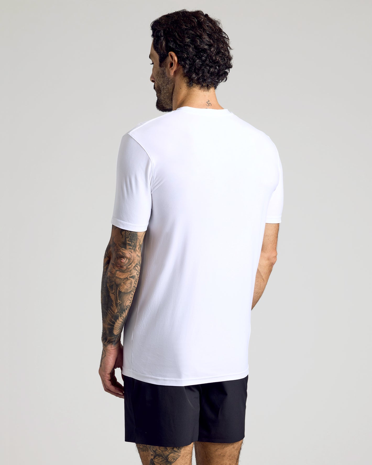 Staple Active Crew 3-Pack: Man in white T-shirt, black shorts, tattooed arm.