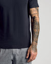 Black Active Mesh Crew 6-Pack on tattooed arm, showcasing breathable fabric.