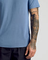 Fiord Active Mesh Crew showcasing breathable mesh and tattooed arm details.