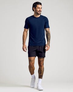 True ClassicMan wearing Black & Navy Active Mesh Crew 6-Pack, showcasing tattoos and white trainers.