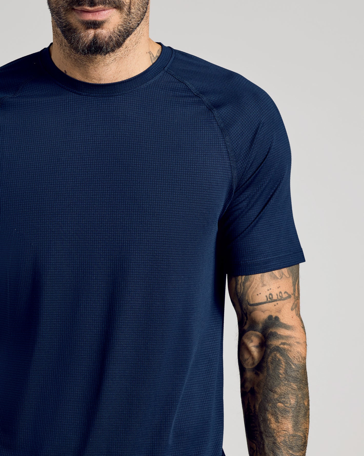 Bearded man in Navy Active Mesh Crew 6-Pack shirt.