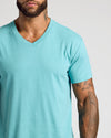 Man wearing Dark Heather Oceanic Classic V-Neck, showcasing tattoos on right arm.