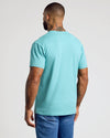 Man in Dark Heather Oceanic Classic V-Neck, showcasing tattoos and athletic fit.