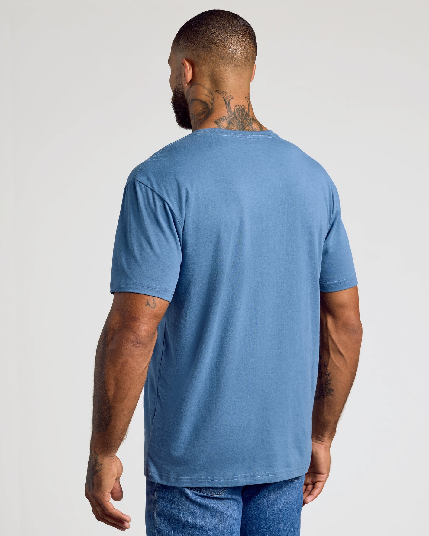 Fiord Classic V-Neck on tattooed male model, back view.