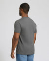 Man wearing a charcoal gray Short Classic Crew Neck 3-Pack t-shirt, shown from the back, paired with light blue jeans, displaying a comfortable fit and classic style for men's basics.