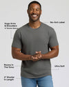 Man wearing a gray Carbon Short Classic Crew Neck shirt with a no-itch label, shorter sleeves that hug arms and shoulders, a roomy torso, ultra-soft fabric, and a slightly shorter length.