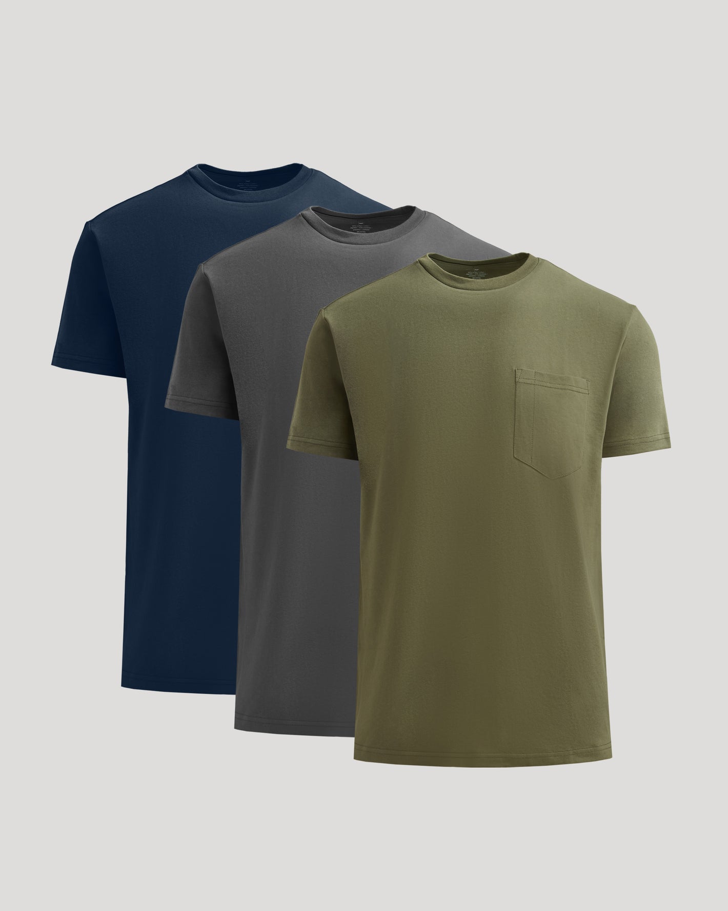 Staple Heavyweight Pocket Crew 3-Pack T-shirts staggered in olive, gray, navy.