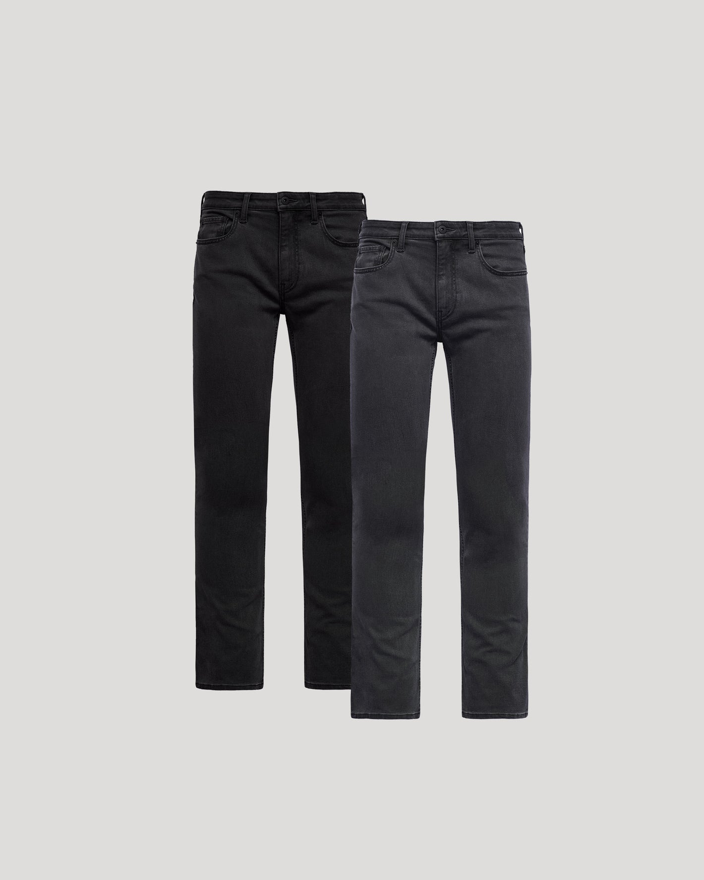 Two pairs of black jeans on a light gray background