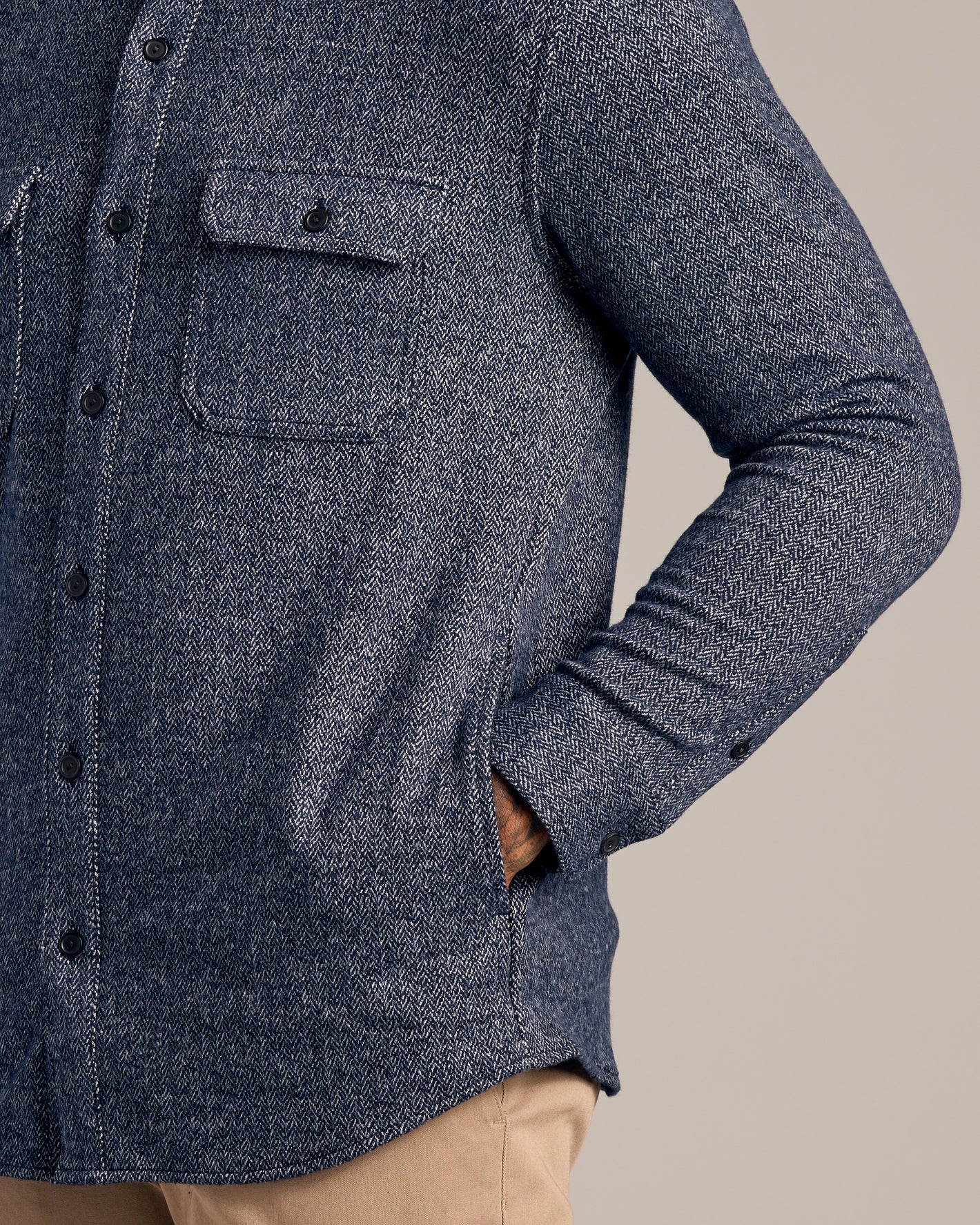 Navy Sweater Shirt Jacket with herringbone weave and black buttons.