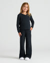 Child wearing Girls Long Sleeve Boxy Waffle Henley, relaxed fit, casual style.