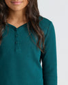 Girls Deep Emerald Waffle Henley on model, showcasing textured, cozy fabric.