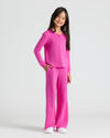 Girl in Girls Long Sleeve Boxy Waffle Henley, fuchsia, smiling confidently.