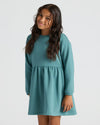 Girl wearing Girls Stormcloud Long Sleeve Fleece Dress with relaxed fit.