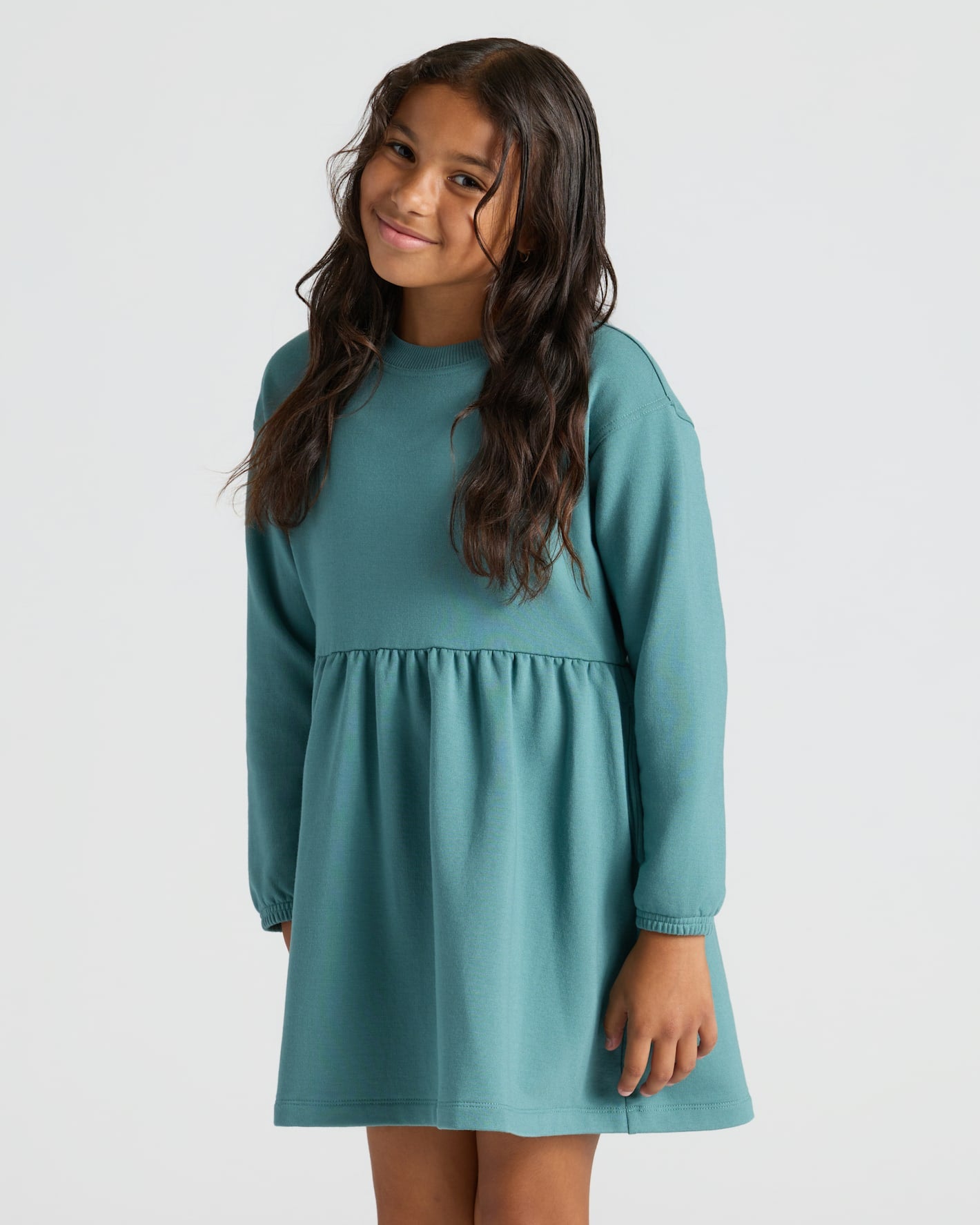 Girl wearing Girls Stormcloud Long Sleeve Fleece Dress with relaxed fit.