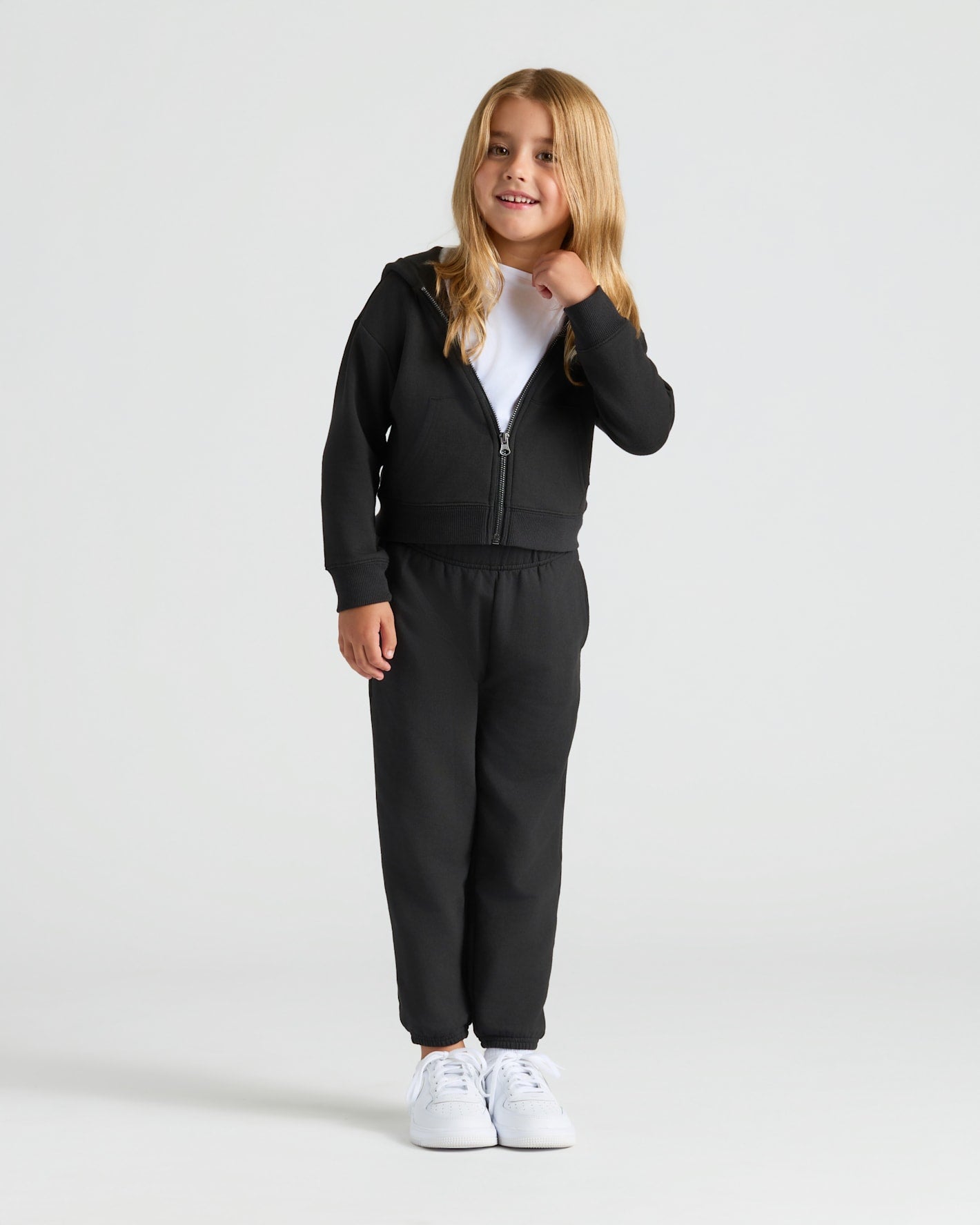 Girls Black & Electric Fuchsia Cropped Zip Hoodie 2-Pack: girl in black hoodie.