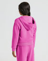 Person in Girls Electric Fuchsia Cropped Zip Hoodie & Relaxed Joggers.