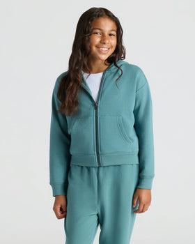 Girls Stormcloud Cropped Zip Hoodie & Relaxed Joggers worn by smiling girl.