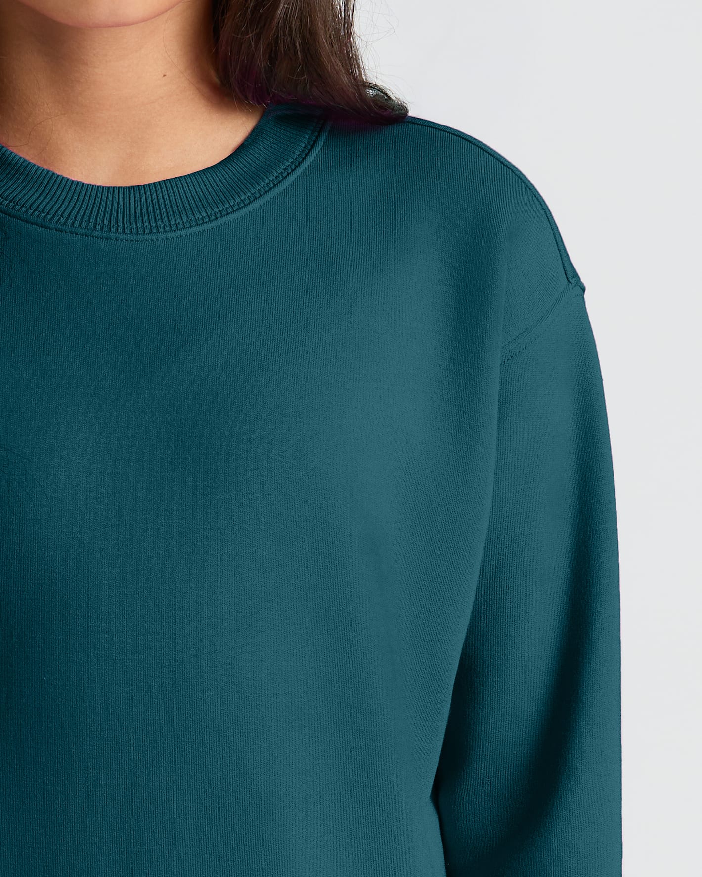 Close-up of Girls Deep Emerald Slouch Pullover Crew's ribbed neckline and sleeve.