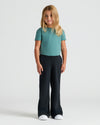 Girl wearing Girls Waffle Wide Leg Pants 3-Pack, relaxed pose, neutral expression.