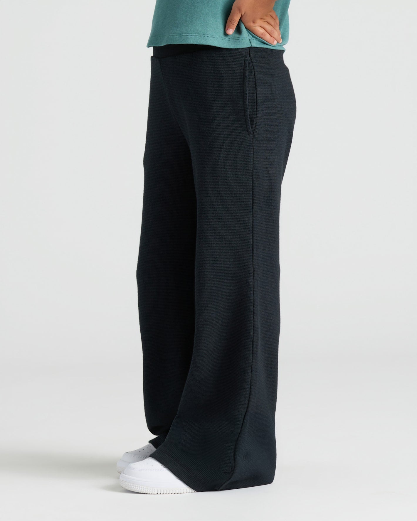 Child wearing Girls Black Waffle Long Sleeve Henley & Waffle Leg Pants.