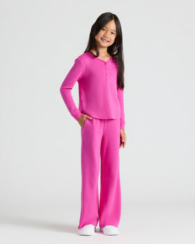 Girl in waffle-knit, wide-leg pants, part of Girls Waffle Wide Leg Pants 3-Pack.