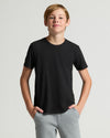 Teen boy in Boys' Classic Curved Hem Crew Neck 3-Pack.