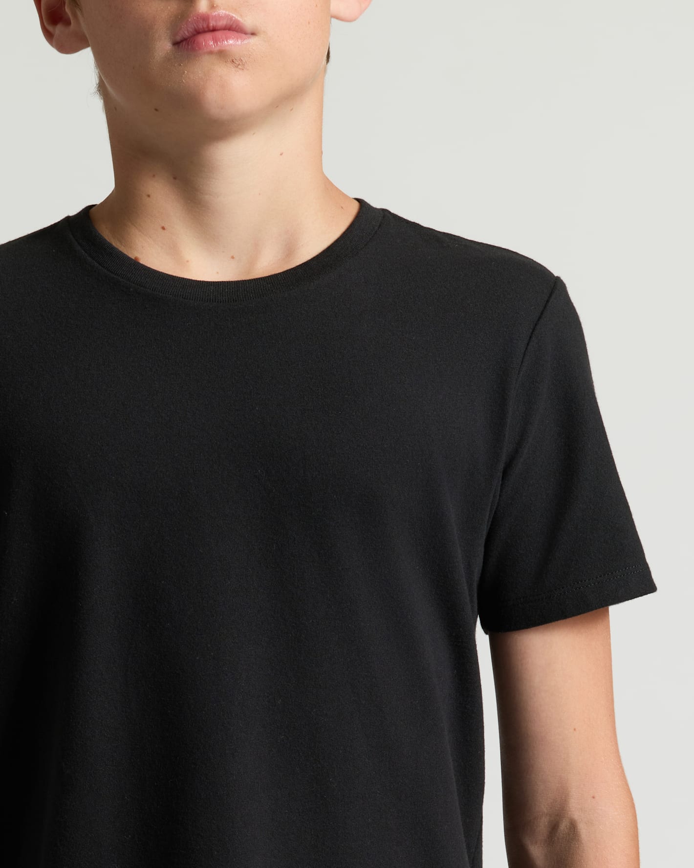 Boys' Classic Curved Hem Crew Neck 3-Pack, plain black tee close-up.