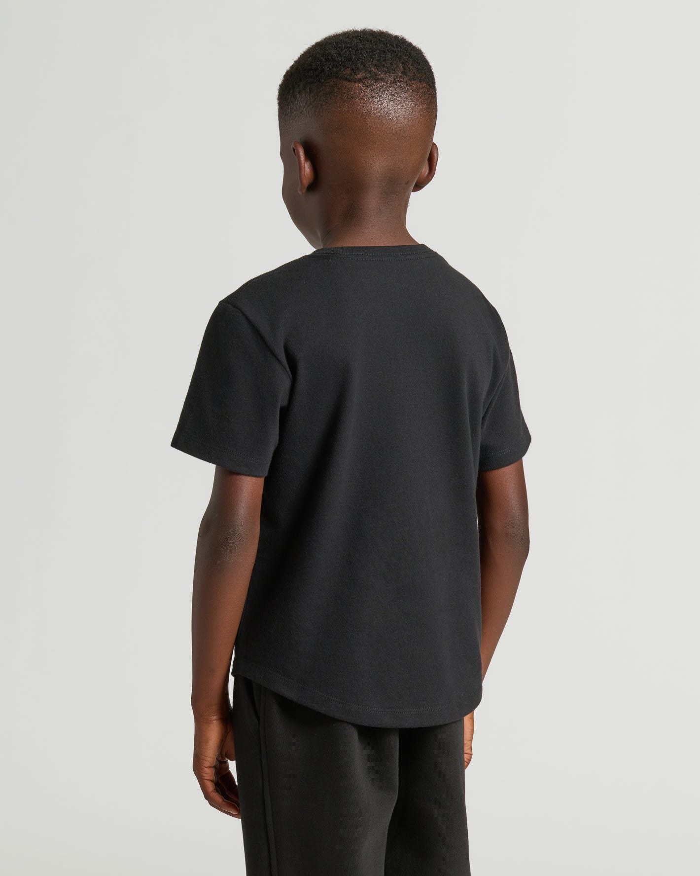 Boys' Black Classic Curved Hem Crew Neck, back view, comfy fit.
