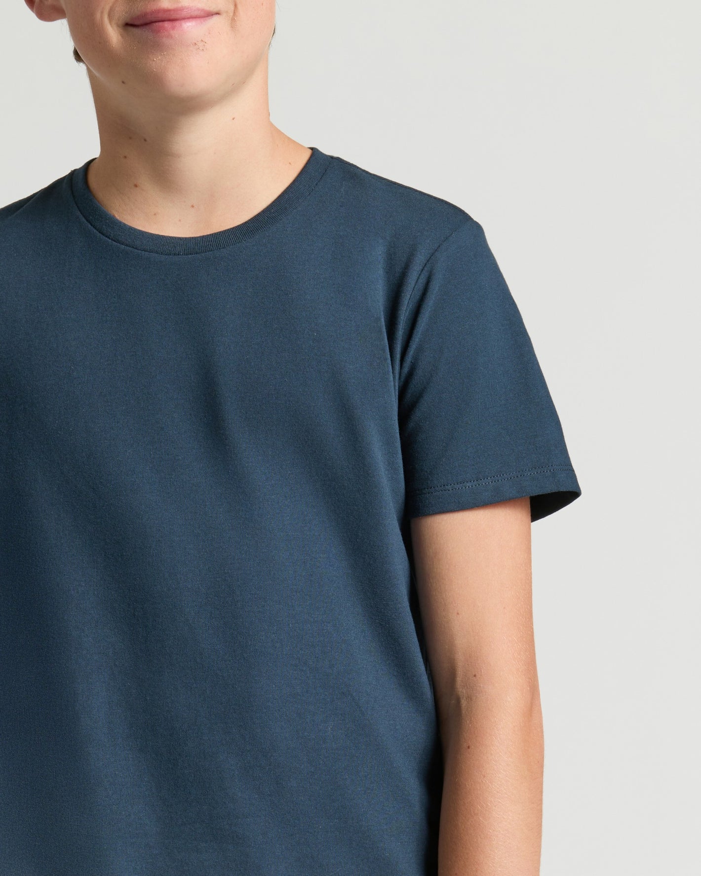 Boys' Navy Classic Curved Hem Crew Neck on light-gray background.