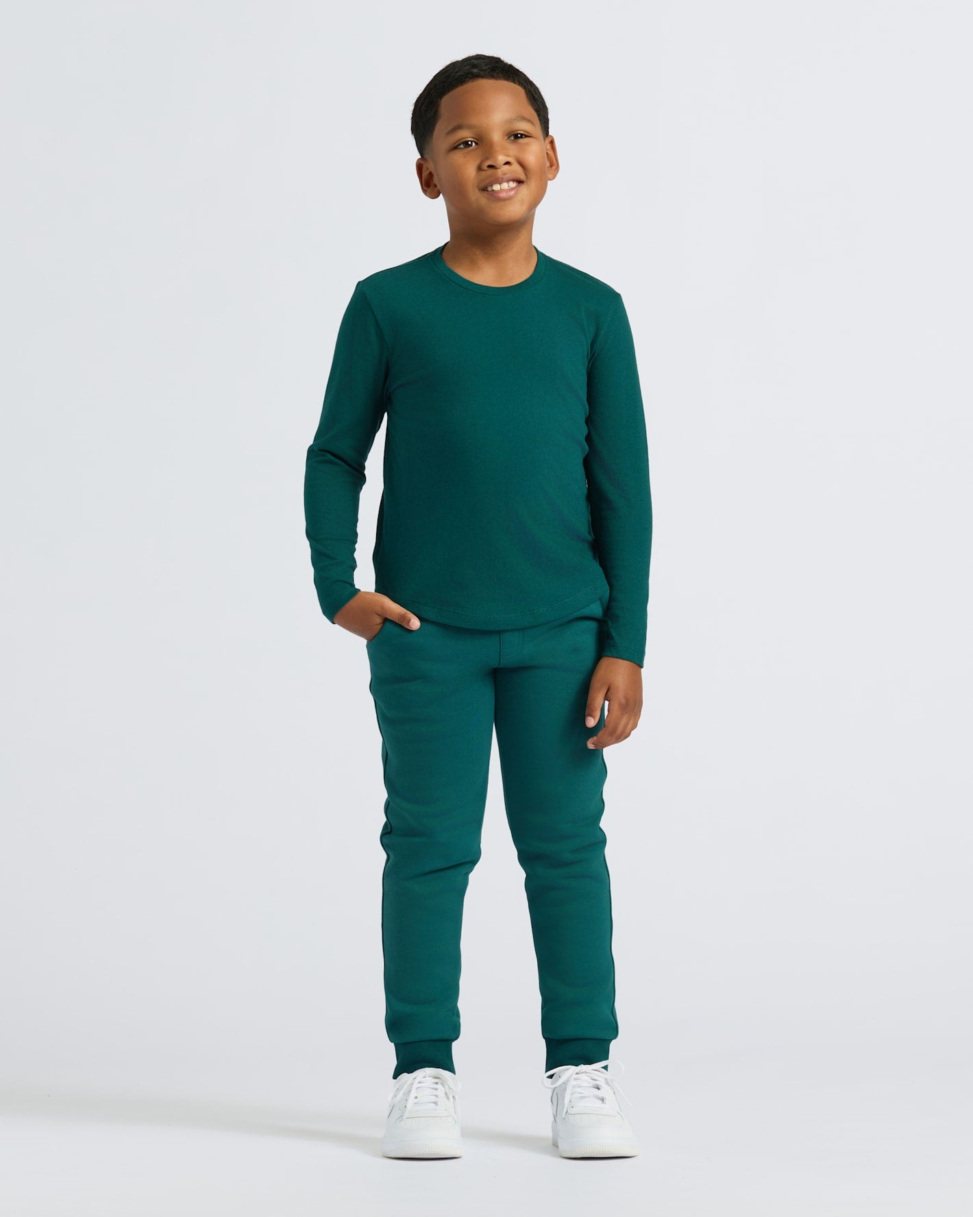 Boy wearing Boys' Classic Long Sleeve Curved Hem Crew Neck, dark green set.