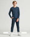 Boy wearing Boys' Navy Classic Long Sleeve Curved Hem Crew with joggers.