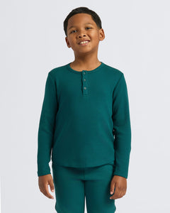 True ClassicBoy wearing Boys' Waffle Long Sleeve Henley, deep teal, smiling gently, arms relaxed.