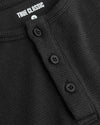 Boys' All Black Waffle Long Sleeve Henley close-up, ribbed collar, buttons.