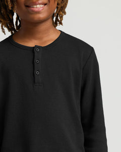 True ClassicBoys Black Long Sleeve Waffle Henley worn by smiling youth.