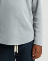 Boys' Waffle Long Sleeve Henley showcased with navy sweatpants.