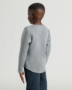 True ClassicBoy wearing Boys Heather Gray Long Sleeve Waffle Henley, back view.