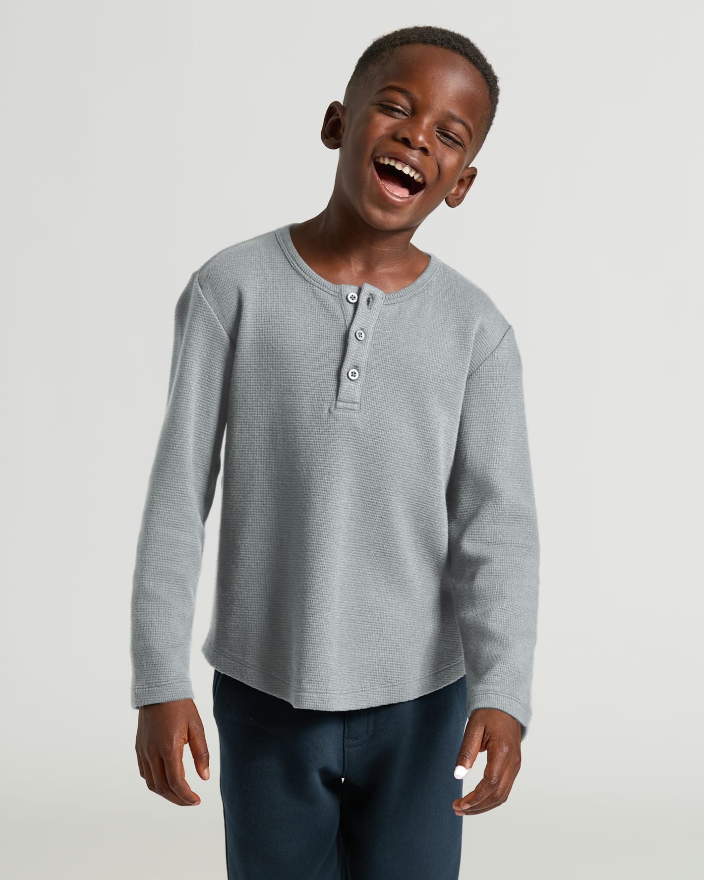 Boys Heather Gray Long Sleeve Waffle Henley worn by joyful boy.