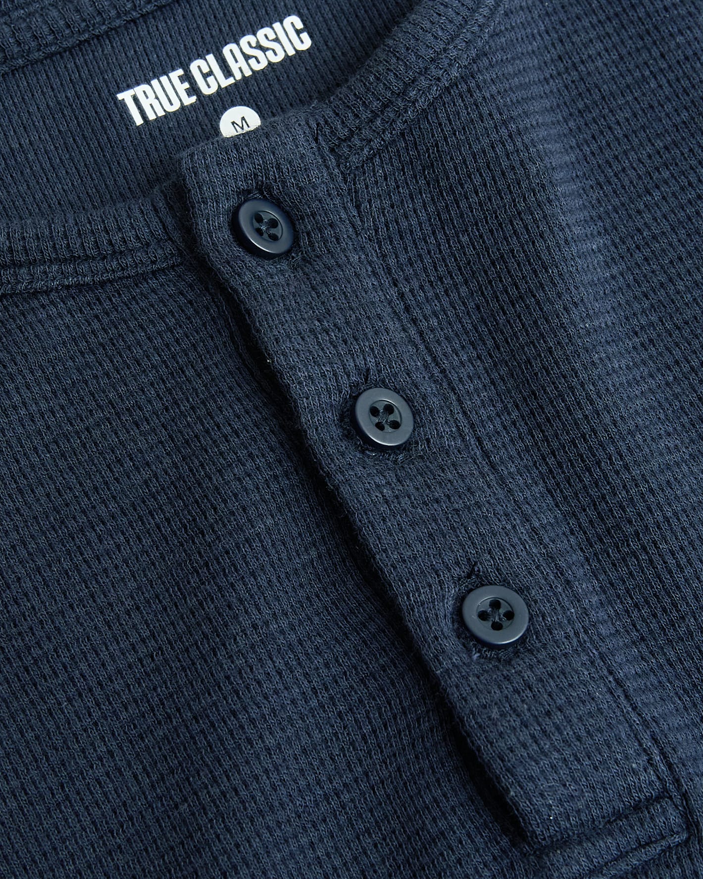 Boys Navy Long Sleeve Waffle Henley with textured fabric and button placket.