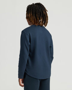 True ClassicBoys Navy Long Sleeve Waffle Henley on child with shoulder-length locks.