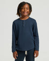 Boy smiling in Boys Navy Long Sleeve Waffle Henley.