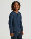 Young person in Boys' Waffle Long Sleeve Henley, navy blue.