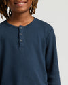 Close-up of person wearing Boys' Waffle Long Sleeve Henley.