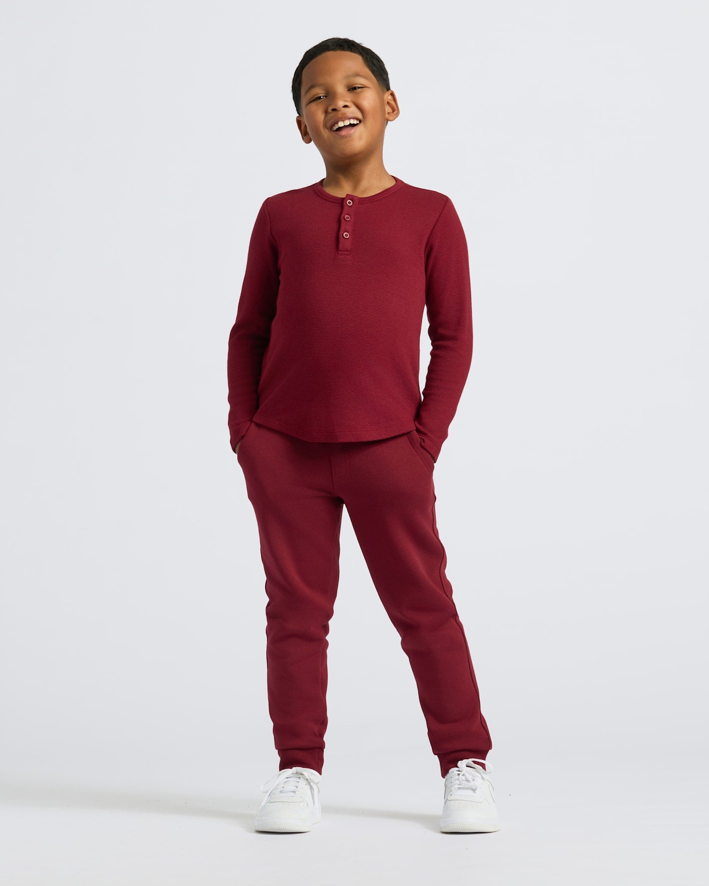 Boys' Dark Maroon Long Sleeve Waffle Henley worn by smiling boy.