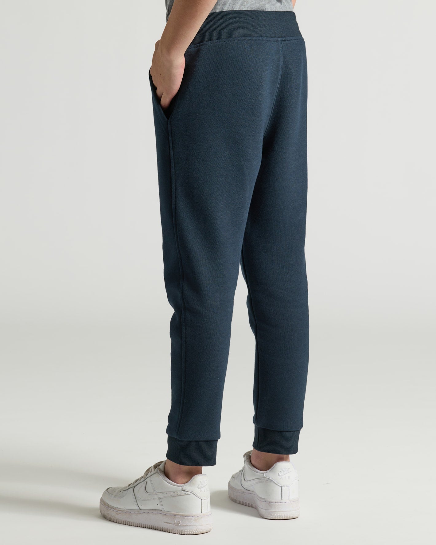 Boys' Black & Navy Fleece Joggers 2-Pack with white sneakers.